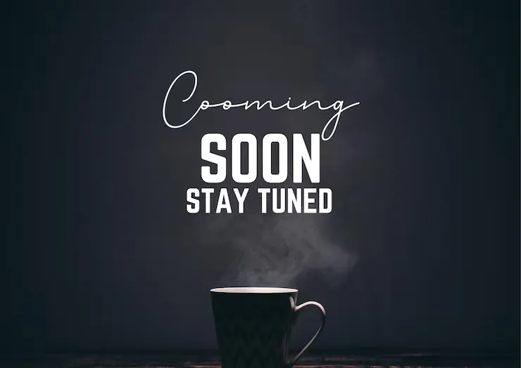 Coming soon, stay tuned — a steaming mug in low light
